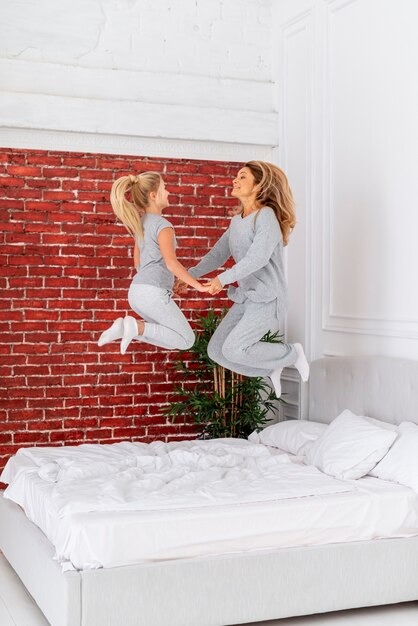 Bed Foams Happy Mother Daughter Jumping by Orient Uniforms for customers in Dubai, Abu Dhabi, Sharjah, Ajman and across the UAE